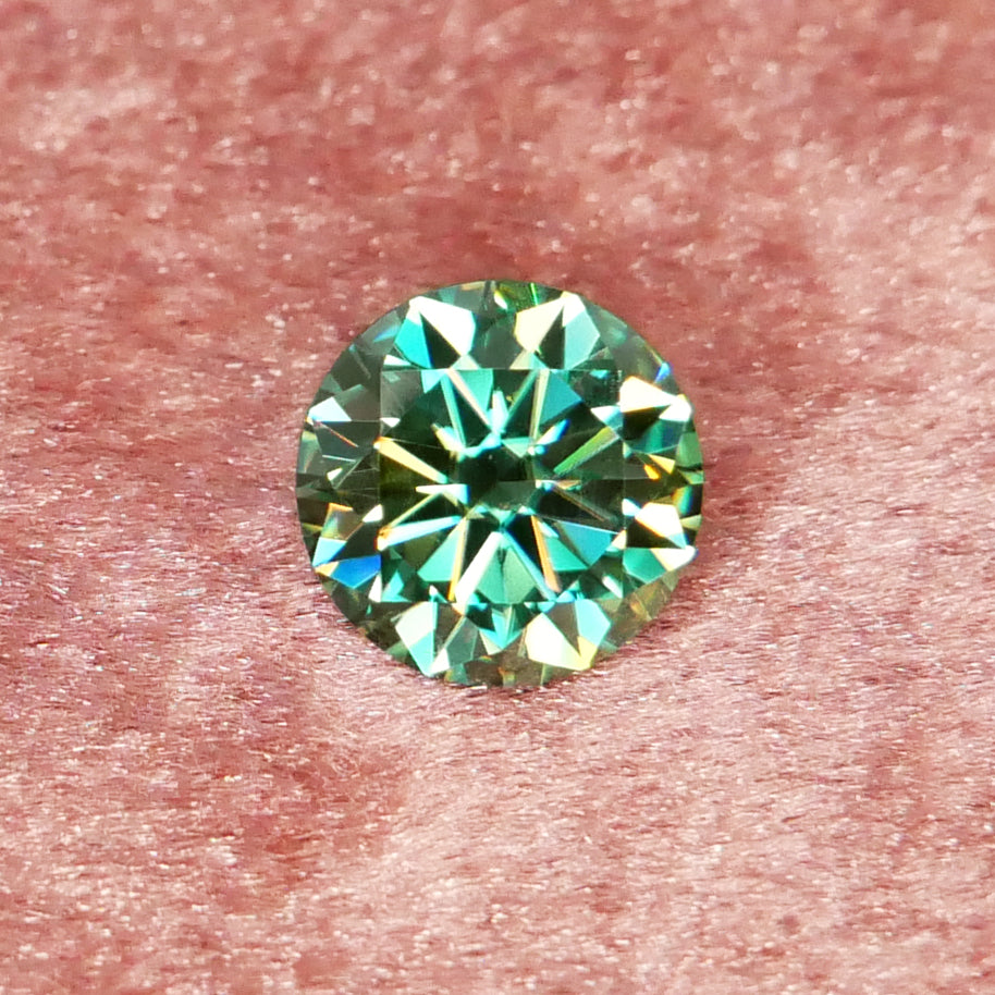 8mm diameter teal (blue-ish green) moissanite