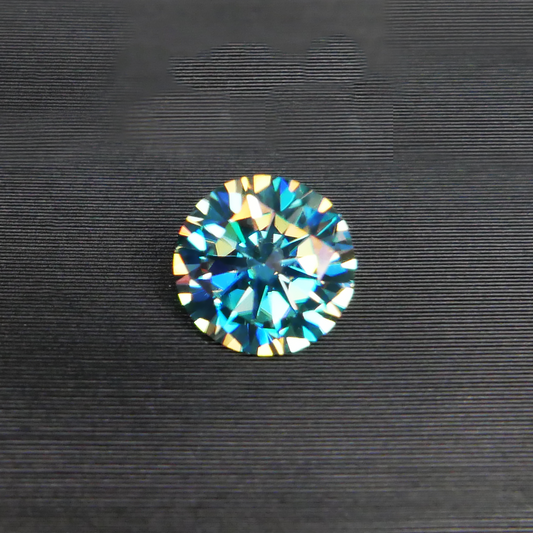 6.5mm diameter teal (green-ish) blue moissanite